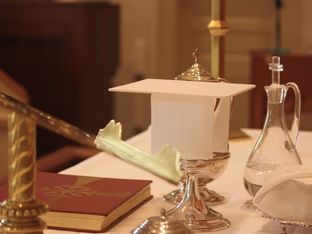 altar set for communion with the Gospel